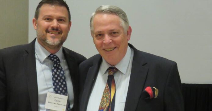 Dr John McDonald (right) presenting at the American Academy of Medical Acupuncture conference in Kansas City with David Miller